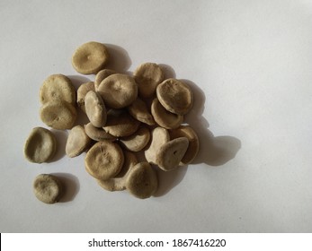 Strychnos Nux Vomica Or Poison Nut Seeds. It Is Also Called Kuchala,Zahra, Kajra Etc. It Is A Deciduous Tree And Is A Native Of India And Southeast Asia.