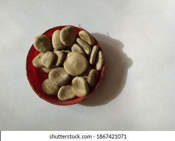 Strychnos Nux Vomica Or Poison Nut Seeds. It Is Also Called Kuchala,Zahra, Kajra Etc. It Is A Deciduous Tree And Is A Native Of India And Southeast Asia.