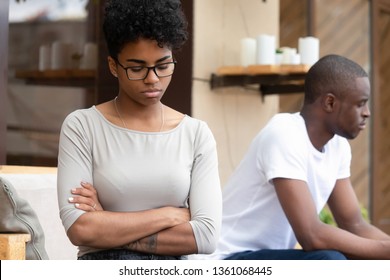 Stubborn African American Couple Angry After Fight Sit Silent Turn Back, Annoyed Jealous Upset Girlfriend With Arms Crossed Ignore Sad Unhappy Boyfriend, Problems In Bad Family Relationship Concept