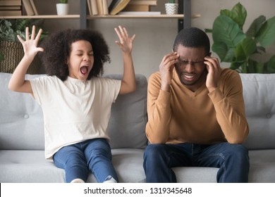 Stubborn Noisy African Child Girl In Tantrum Screaming At Annoyed Tired Black Father, Naughty Kid Daughter With Attention Deficit Yelling, Manipulation, Family Fight, Parents And Children Conflict