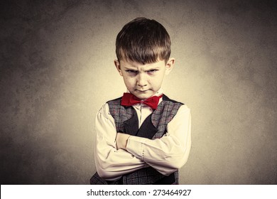 Stubborn,sad,upset  Little Boy,child  Isolated Over Grey Background.Facial Expression