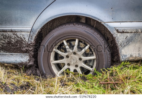 Stuck car in the\
mud
