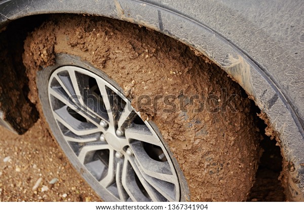 Stuck car wheel in the
mud, close-up