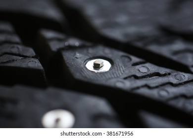 Studded Tire On A  Background