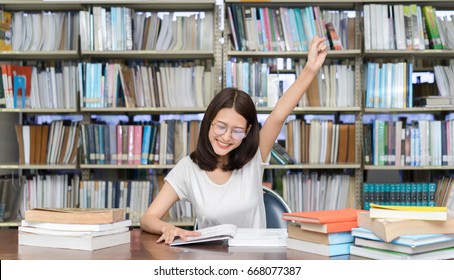 Student Asian Girl Study With Glasses Finish Hard Reading Book Homework And Happy Learning Feeling Relax In Classroom Lesson Education Library Knowledge Center College High School University. 