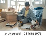 Student asian woman organize room unpack in dorm room college student moving to new  university dormitory or preparing to move out