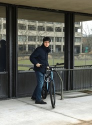 Student With Bicycle At Stony Brook University (SBU), Public Research University On Long Island In Stony Brook, New York