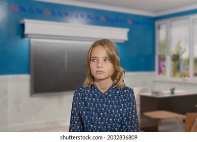 A Student In A Blue Dress Has Forgotten Something And Is Trying To Remember Against The Background Of The School Class.
