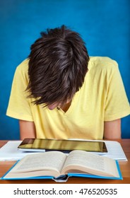 Student with the Books and Tablet Computer