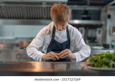 Student boy studying cooking food in class at school kitchen. - Powered by Shutterstock