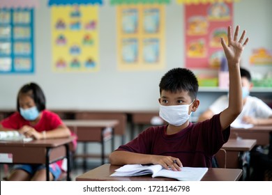 Student Boy Wear A Mask To Prevent The Spread Of Covid 19 In The Coronavirus Classroom, Seasonal Influenza Pandemic, Colds, Respiratory Epidemic.