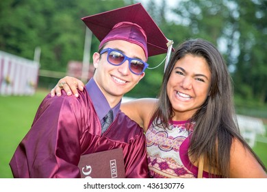 Student celebrates graduation with friend - Powered by Shutterstock