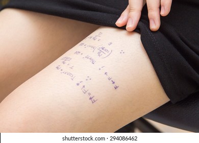 Student Cheat On Exams By Writing Equation Words On The Legs.