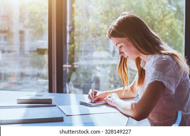 student in classroom during exam - Shutterstock ID 328149227