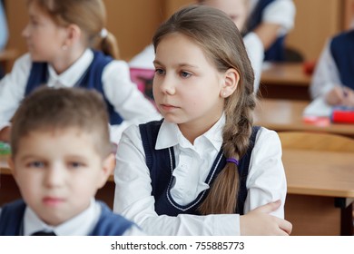 A student in the classroom listens carefully