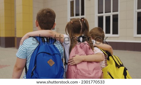 student concept. friendly team. hugging student. school backpack carried by group schoolchildren. happy student life. friendship classmates. teamwork. victory school relationships. friendship team