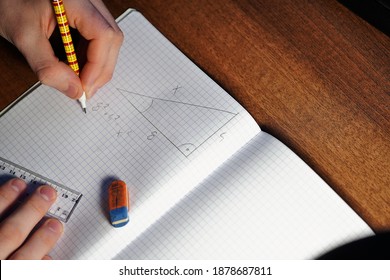 
the student counts math tasks in the notebook using the Pythagorean theorem - Powered by Shutterstock