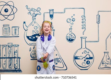student doing research with chemical fluid in the laboratory - Powered by Shutterstock