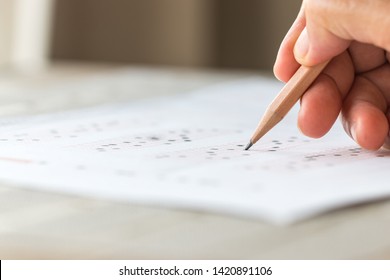 Student Doing Test Or Exam On Optical Form Of Standardized Multiple Choice With Answers And English Paper Sheet For Admission In Thai University Classroom. Examination Knowledge In School Concept