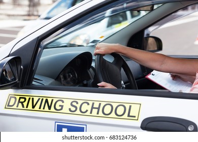 Student driver. Learning to drive a car. Driving school.