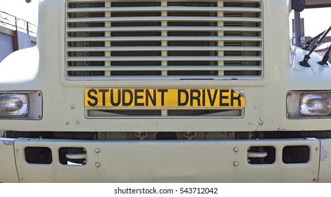 STUDENT DRIVER sign on front of semi truck. Horizontal.