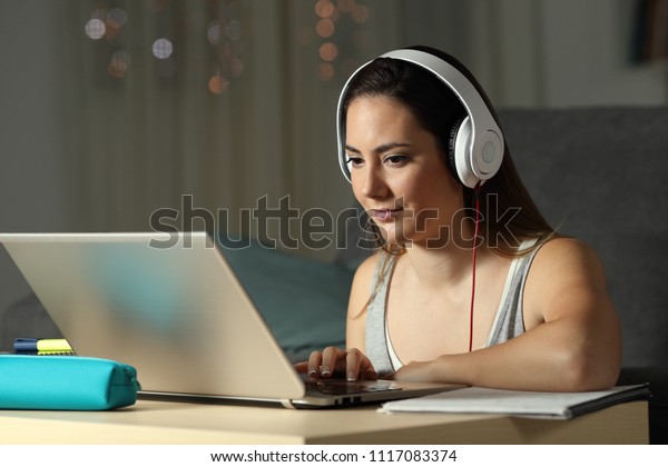 Student Elearning Wearing Headphones Watching Online Stock Photo ...