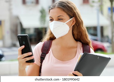 Student Female With Protective Mask Reading A Message On Smart Phone In The Street