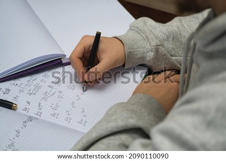 the student is getting ready for a very important exam. Solve math problems to learn. Learning math at home.