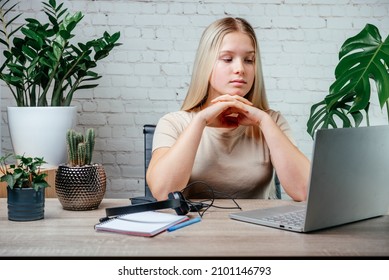 Student Girl In Headphones Watching Online Video Zoom Class Webinar In Virtural Classroom On Her Laptop