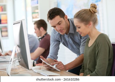 Student Girl With Trainer Working On Computer And Tablet