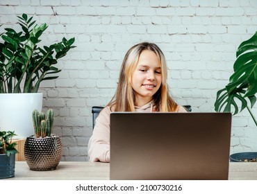 Student Girl Watching Online Video Zoom Class Webinar In Virtural Classroom On Her Laptop