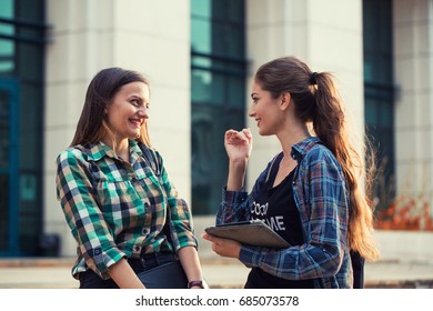 Student Girls Having A Small Talk. After Class Fun Time. Back To School Concept.