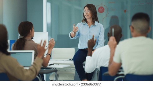 Student hand, question and woman professor in a classroom with lecture and studying for college. University class, learning and students with education and teacher on campus with a school group - Shutterstock ID 2306863397