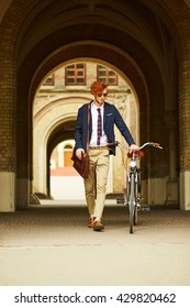 Student At Harvard Style With Bike Near University 