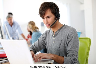 Student with headset on doing English language test - Powered by Shutterstock