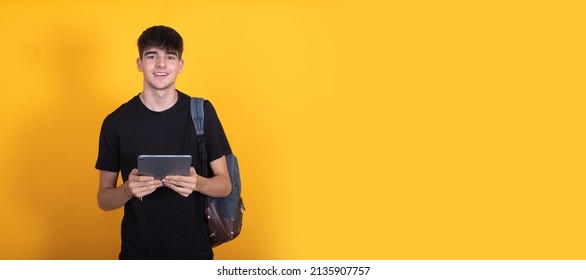 student isolated on background with tablet or computer with backpack - Powered by Shutterstock