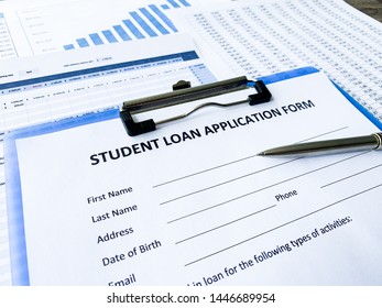 Student loan application form document on table - Shutterstock ID 1446689954