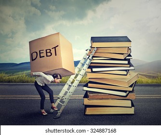 Student Loan Debt Concept. Young Woman With Heavy Box Full Of Debt Carrying It Up The Education Ladder 