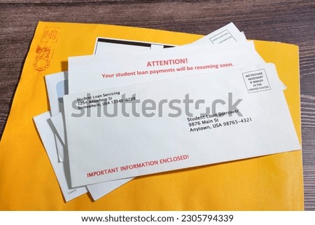 Student Loan Payments Resuming Notice in Envelope on top of other mail.