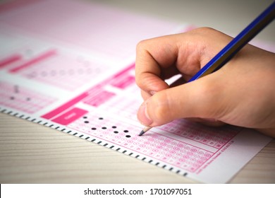 Student Marking The Exam Answer Sheet