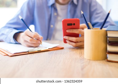 student with mobile phone in school