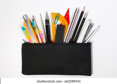 Student Pencil Bag Or Pencil Case With School Supplies For Student. Black Pencil Box With School Equipment Isolated On White Background. Top View