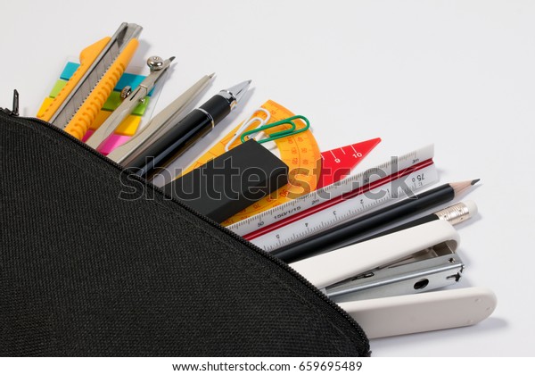 Student pencil bag or pencil case with school\
supplies for student. Black pencil box with school equipment\
isolated on white\
background.
