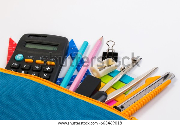 Student pencil bag or pencil case with school
supplies for student on white background. Blue pencil box with
school equipment for math class isolated on white background.
School math equipment.