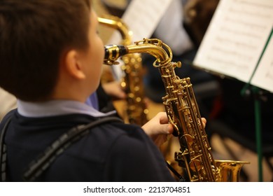 A Student Playing The Saxophone In An Orchestra Background Image Details Of A Musical Instrument Close-up