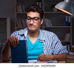 Student preparing for exams late night at home - Shutterstock ID 1432992434