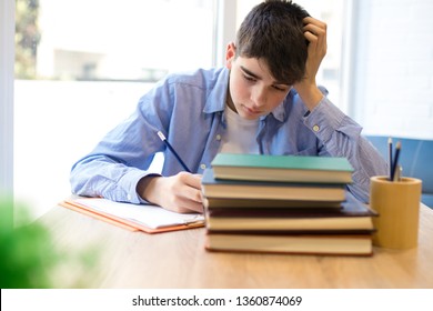 Student With Problems Or Stress At The Desk