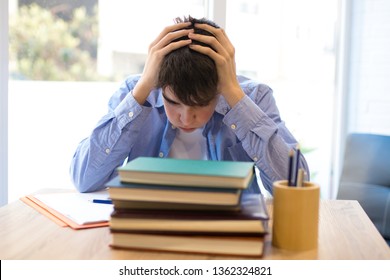 student with problems or stress at the desk