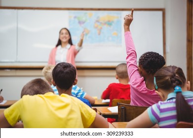 Student Raising Hand To Ask A Question At The Elementary School