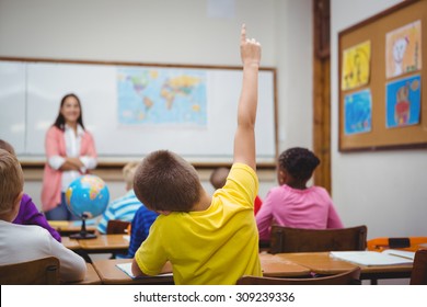 Student Raising Hand To Ask A Question At The Elementary School